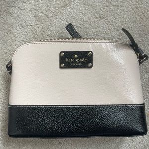 Kate Spade color black Crossbody purse. Tan/cream and black combo..